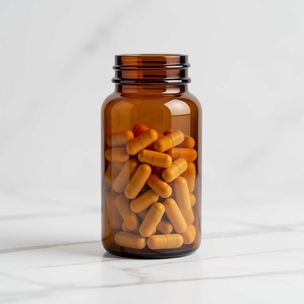 Dark amber glass supplement bottle on pale marble surface, editorial minimal arrangement, soft natural light from the left